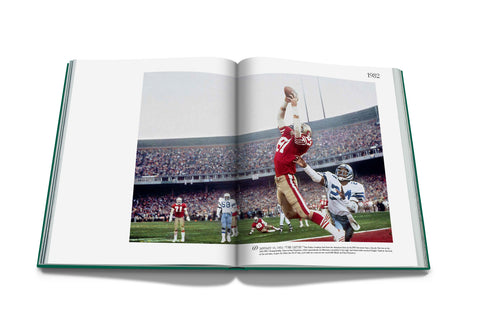 Open book showing a photograph of a football player in action on a field with spectators.
