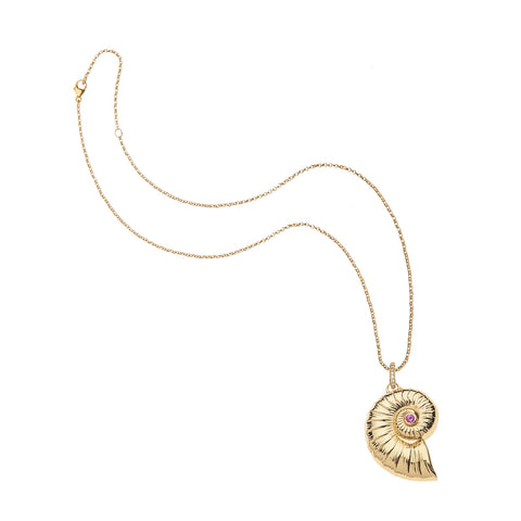 Nautilus shell pendant in yellow gold with pink tourmaline in the center on gold chain.
