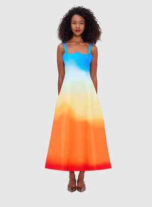 Model wearing the odette ombre midi dress with scalloped neckline.