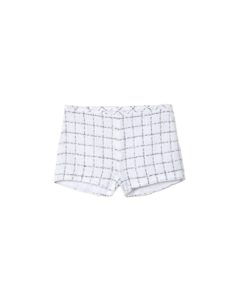 White shorts with black grid pattern on a gray background