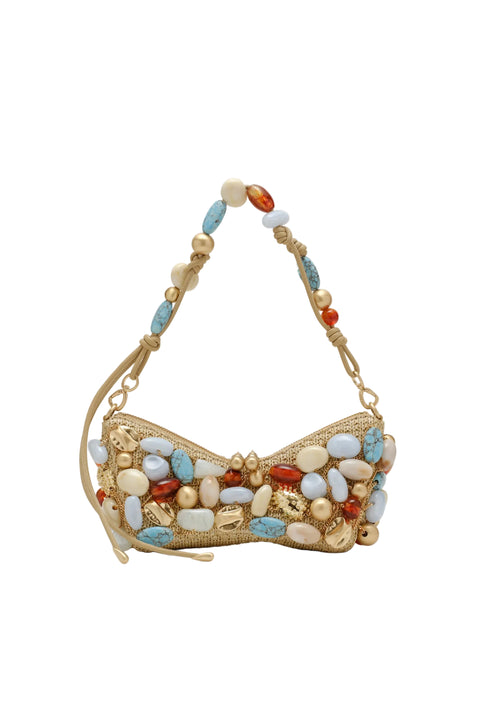 Gold handbag with colorful beads on a beige background