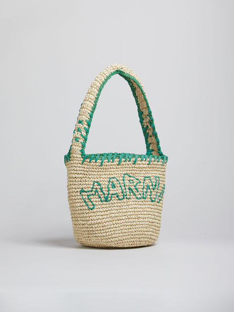Side veiw of Woven basket with green trim and 'Marni' branding on a light gray background