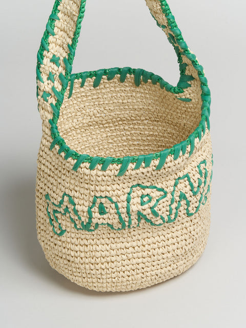 Top view of Woven basket with green trim and 'Marni' branding on a light gray background