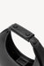 Detail shot of a small, black leather, moon shaped handbag with white stitching and a black leather strap on the handle. 