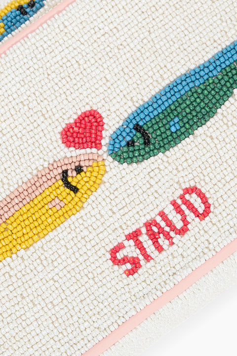 Detail shot of two multicolor sardines kissing with a red heart, placed above the STAUD logo in red on the back of the handbag.