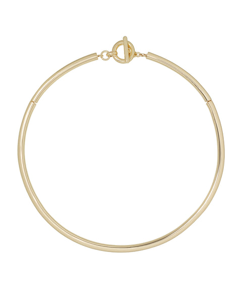 A gold-toned, tubular collar necklace with a toggle clasp.