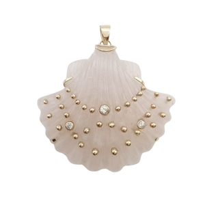 Pink shell pendant with gold studs and white sapphire on a white background