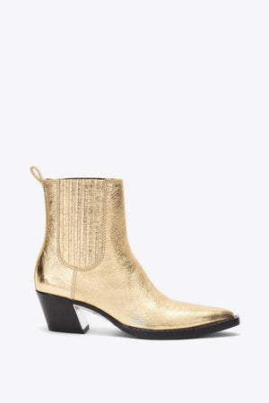 Metallic gold chelsea boot with black heel.