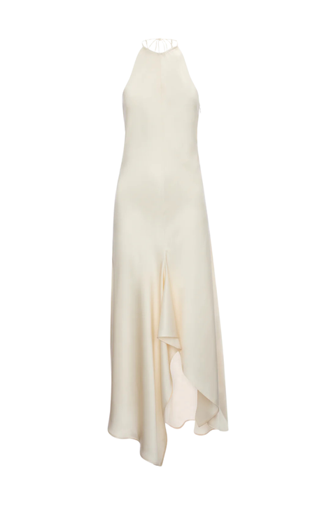 An off-white, cream-colored high-neck sleeveless maxi dress with a draped asymmetrical hem, displayed on a mannequin against a plain white background.