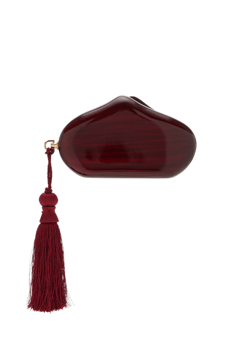 Red magnetic closure clutch with tassel