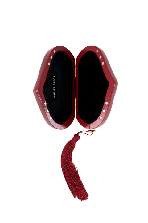 Red clutch with tassel and velvet interior